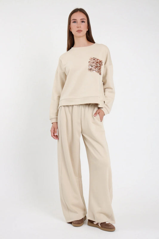 Pantaloni tuta barrel panna donna Susy Mix – look completo con felpa girocollo paillettes"